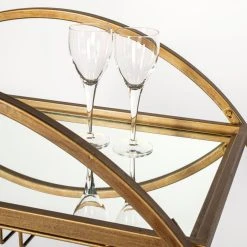 Buy ⌛ Mercana Carola Gold Frame Two-Tier Glass Shelves W/Stemware Holder Bar Cart - 36.25L X 18.0W X 40.25H 🎁 -Mercana Shop Mercana Carola Gold Frame Two Tier Glass Shelves w Stemware Holder Bar Cart 7